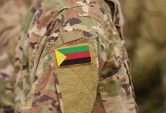 Flag of Azawad on soldiers arm. Flag of State of Azawad on military uniforms (collage). xkwx armed, army, attack, azawad, civil, conflict, country, defender, flag, force, freedom, government, guard, i ...
