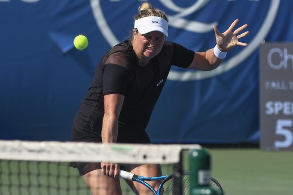 Kim Clijsters, of Belgium, hits a backhand against Su-Wei Hsieh, of Taiwan, during the third set of her first round match in the Chicago Fall Tennis Classic tournament, Monday, Sept. 27, 2021, in Chic ...