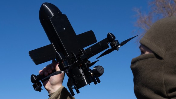 An instructor from the Ukrainian company General Cherry demonstrates the operation of an anti-air interceptor drone designed to destroy Russian attack drones in Kyiv region, Wednesday, March 11, 2026. ...