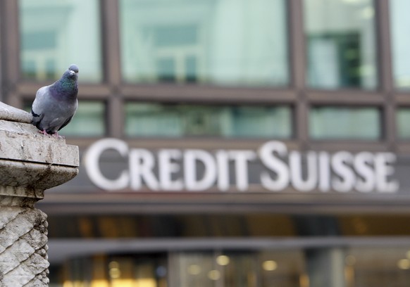 FILE - A pigeon rests near a building hosting offices of Credit Suisse bank in Milan, Tuesday, Oct. 27, 2009. Credit Suisse said Monday, Oct. 17, 2022, that it has agreed to pay $495 million as part o ...