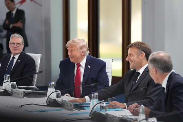 From left, British Prime Minister Keir Starmer, U.S. President Donald Trump, French President Emmanuel Macron and Canadian Prime Minister Mark Carney during a working session at the G7 summit in Evian ...