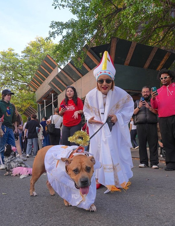 NEW YORK, UNITED STATES - OCTOBER 19: Dog owners in New York City are participating in the Tompkins Square Halloween Dog Parade, dressing their furry friends in colorful costumes on Sunday, October 19 ...