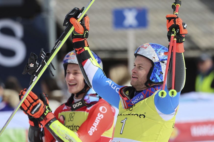 France&#039;s Alexis Pinturault and Switzerland&#039;s Marco Odermatt react after completing an alpine ski, men&#039;s World Cup giant slalom in Kranjska Gora, Slovenia, Sunday, March 12, 2023. (AP Ph ...