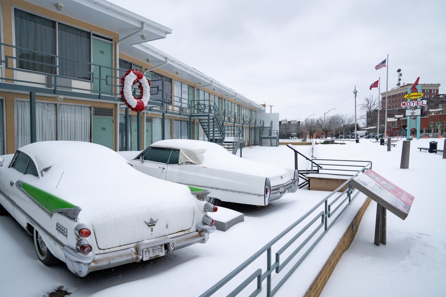 Two snow-covered vintage cars are parked at the Lorraine Motel, where Martin Luther King was assassinated in 1968, in Memphis, Tennessee, on January 25, 2026. A massive winter storm headed towards the ...