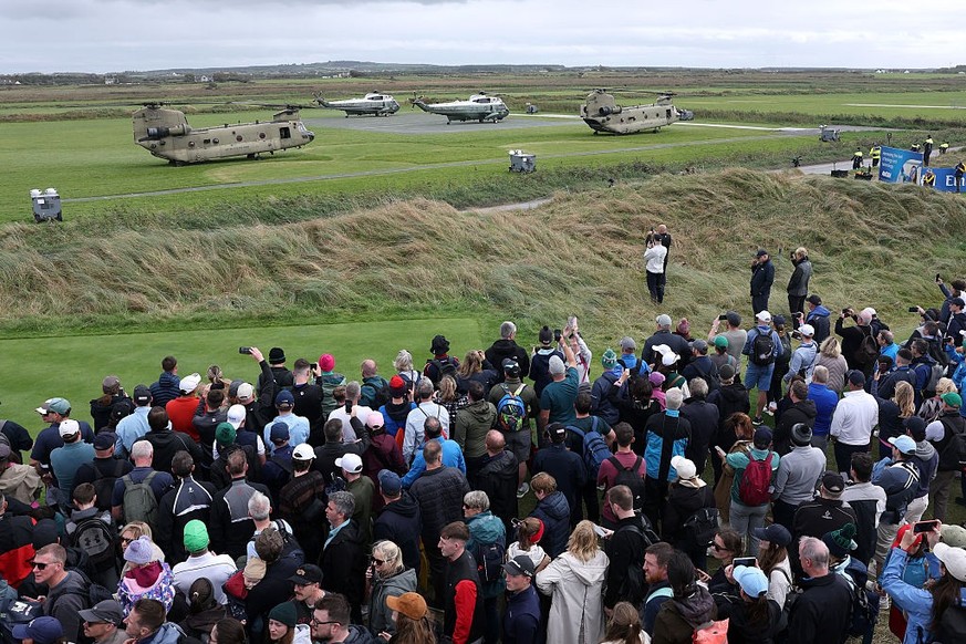 CLARECASTLE, IRELAND - SEPTEMBER 12: Crowds gather to watch Marine One carrying U.S. President Donald Trump land at the course on day three of the Amgen Irish Open at Trump International Golf Links in ...
