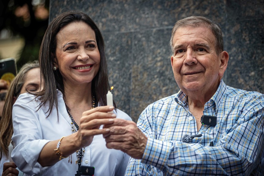 epa11679439 (FILE) - The presidential candidate of Venezuela&#039;s main opposition alliance, Edmundo Gonzalez Urrutia, attends a prayer event with the opposition leader Maria Corina Machado in Caraca ...