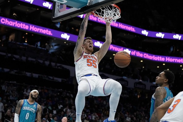 New York Knicks center Isaiah Hartenstein dunks against the Charlotte Hornets during the second half of an NBA basketball game on Saturday, Nov. 18, 2023, in Charlotte, N.C. (AP Photo/Chris Carlson)