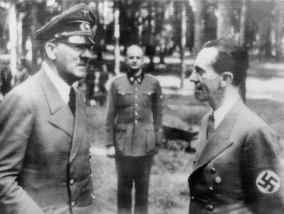 In this official Nazi photo obtained by The Associated Press via neutral Swedish photo agency Pressens Bild, German caption describes a meeting of Adolf Hitler with Dr. Joseph Goebbels, right, at Der  ...