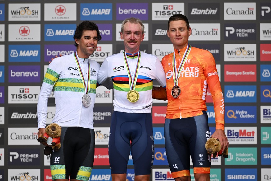 MONTREAL, QUEBEC - SEPTEMBER 27: (L-R) Silver medalist Michael Matthews and Team Australia, gold medalist Brandon McNulty and Team United States and bronze medalist Mathieu Van Der Poel and Team Nethe ...