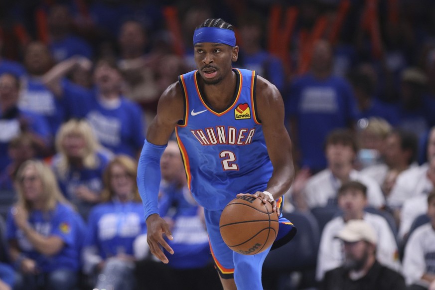 Oklahoma City Thunder guard Shai Gilgeous-Alexander (2) dribbles down the court during the second half of Game 5 of the Western Conference finals of the NBA basketball playoffs against the Minnesota T ...