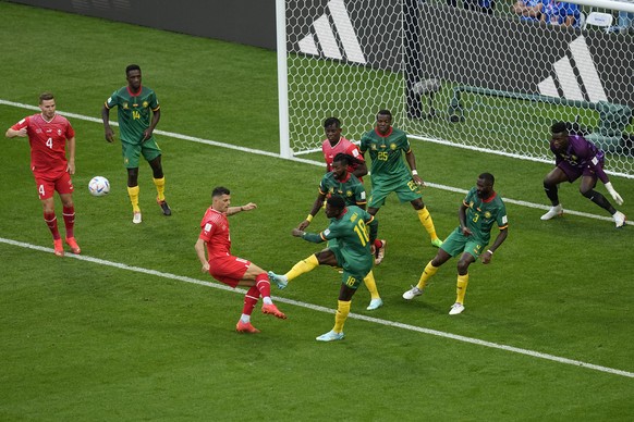 Cameroon's Martin Hongla (18) blocks a shot during the World Cup group G soccer match between Switzerland and Cameroon, at the Al Janoub Stadium in Al Wakrah, Qatar, Thursday, Nov. 24, 2022. (AP Photo ...