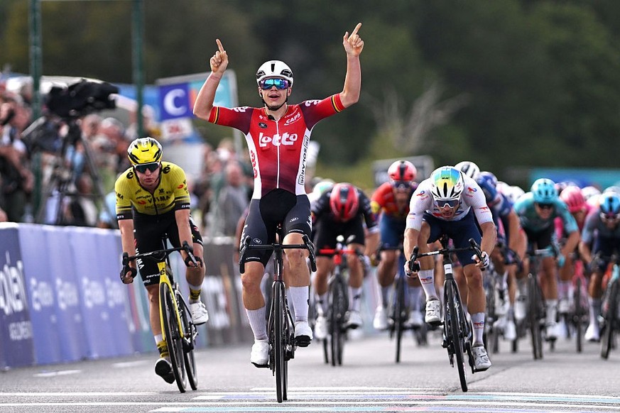 PLOUAY, FRANCE - AUGUST 31: Arnaud De Lie of Belgium and Team Lotto celebrates at finish line as race winner ahead of of (L-R) Olav Kooij of Netherlands and Team Visma | Lease a Bike and Emilien Jeann ...