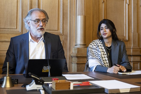epa13038637 Rima Hassan (R), French-Palestinian Member of the European Parliament, lawyer and activist visits Council of States member Carlo Sommaruga (L) and other parliamentarians for a meeting at t ...