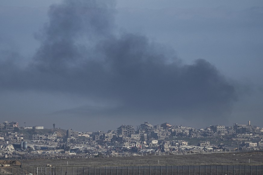 Smoke rises following an Israeli airstrike in the Gaza Strip, as seen from southern Israel on Sunday, Jan. 19, 2025. (AP Photo/Tsafrir Abayov)