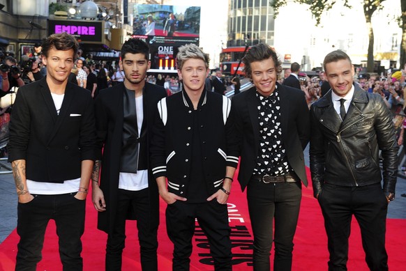 FILE - Louis Tomlinson, from left, Zayn Malik, Niall Horan, Harry Styles and Liam Payne arrive for the World Premiere of "One Direction: This Is Us," at the Empire Leicester Square, in Londo ...