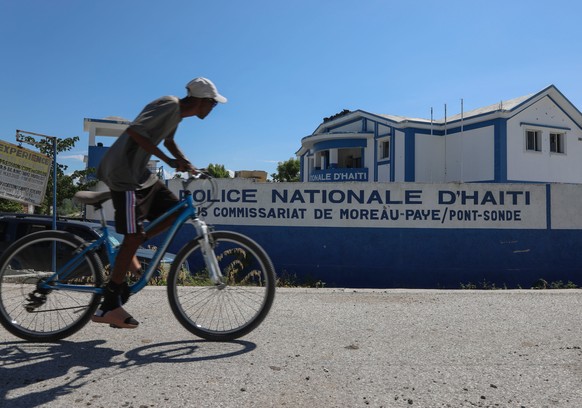 FILE - A man rides his bicycle past police station in Pont-Sonde, Haiti, Oct. 7, 2024. (AP Photo/Odelyn Joseph, File)
Haiti Gang Violence