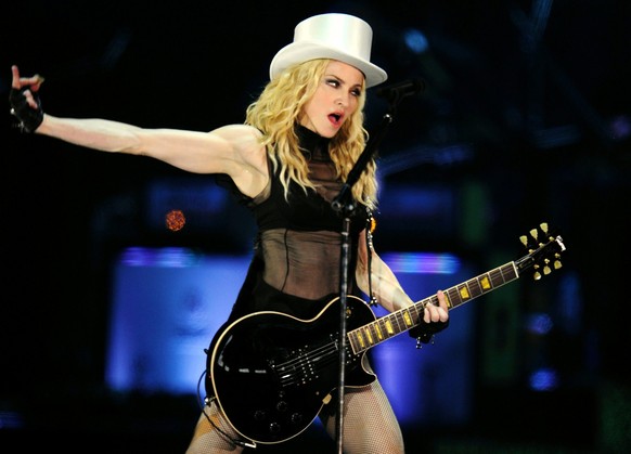 US singer Madonna performs on stage during her concert of the "Sticky and Sweet" world tour, on the military airport in Duebendorf, near Zurich, Switzerland, Saturday, August 30, 2008. Accor ...