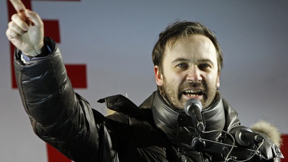 State Duma lawmaker and opposition activist Ilya Ponomaryov speaks during an opposition rally in Moscow, Russia, Monday, March 5, 2012. Riot police on Monday broke up an opposition protest contesting  ...