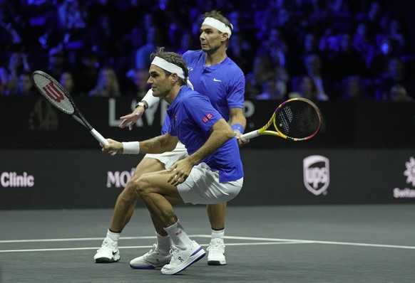 Team Europe's Roger Federer, front, and Rafael Nadal in action during their Laver Cup doubles match against Team World's Jack Sock and Frances Tiafoe at the O2 arena in London, Friday, Sept. 23, 2022. ...