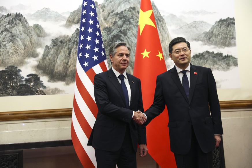 U.S. Secretary of State Antony Blinken, left, shakes hands with Chinese Foreign Minister Qin Gang, right, at the Diaoyutai State Guesthouse in Beijing, China, Sunday, June 18, 2023. (Leah Millis/Pool  ...