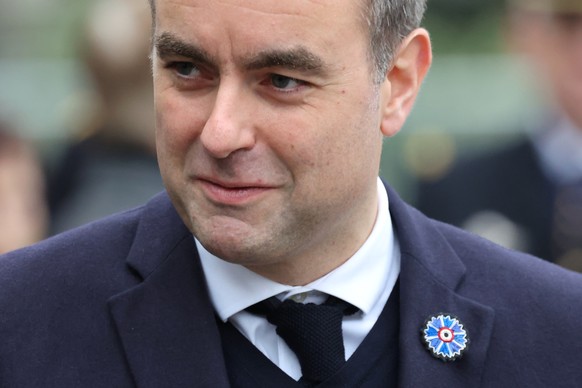 epa12517572 France&#039;s Prime Minister Sebastien Lecornu arrives to attend a wreath-laying ceremony in front of the statue of Georges Clemenceau on the Champs-Elysees in Paris, France, 11 November 2 ...