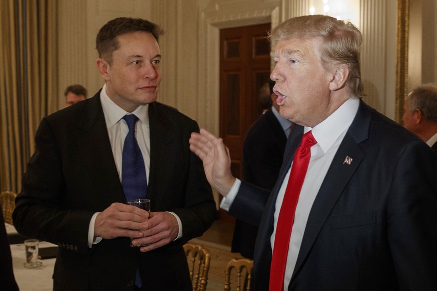 FILE - President Donald Trump, right, talks with Tesla and SpaceX CEO Elon Musk at the White House in Washington, Feb. 3, 2017. (AP Photo/Evan Vucci, File)
Donald Trump,Elon Musk,Steve Bannon