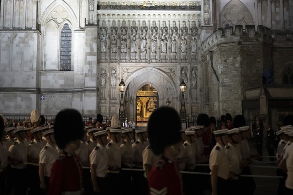 Guards and Royal Navy march past Westminster Abbey during a rehearsal for the funeral procession of Queen Elizabeth II in London, Thursday, Sept. 15, 2022. The Queen will lie in state in Westminster H ...