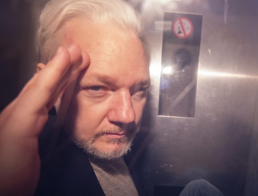 epa07622698 - Wikileaks co-founder Julian Assange, in a prison van, as he leaves Southwark Crown Court in London, Britain, 01 May 2019 (reissued 03 June 2019). Reports on 03 June 2019 state Uppsala Di ...