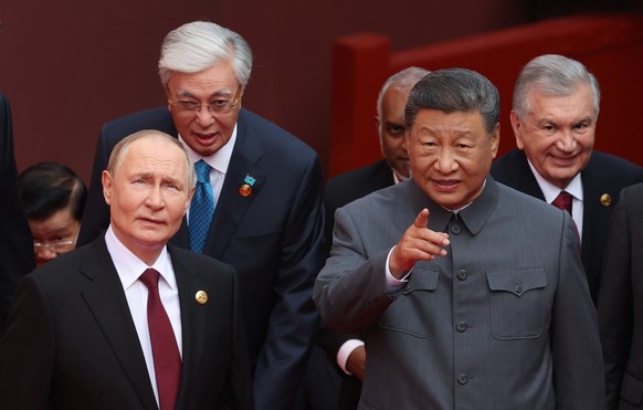 epa12347499 Russian President Vladimir Putin, Kazakh President Kassym-Jomart Tokayev, Chinese President Xi Jinping and Uzbek President Shavkat Mirziyoyev arrive to attend a military parade marking the ...