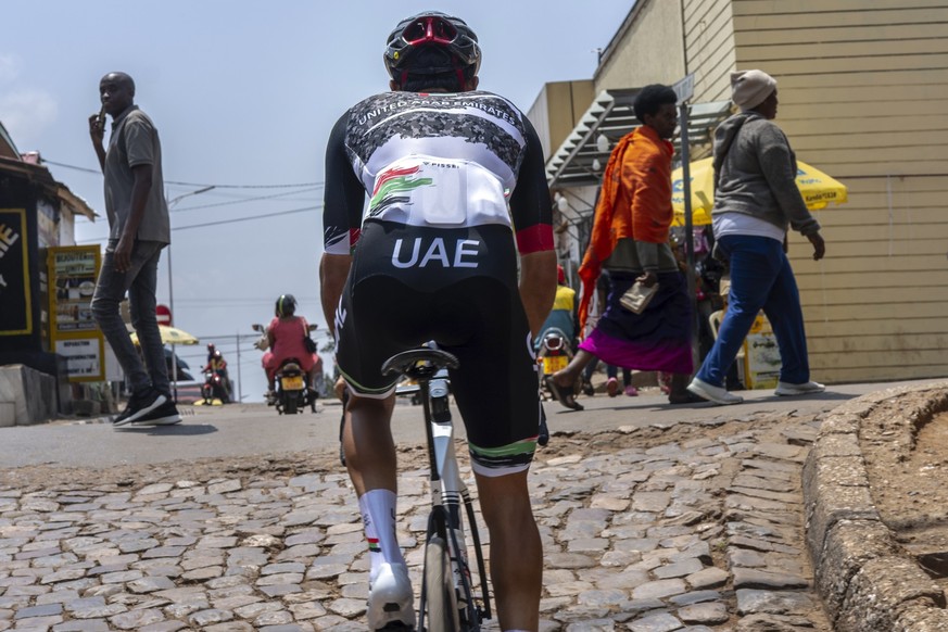 Members of the National UAE team practice on the Wall of Kigali, Rwanda, Friday, Sept. 19, 2025, in anticipation of the upcoming UCI road cycling world championships. (AP Photo/Jerome Delay)