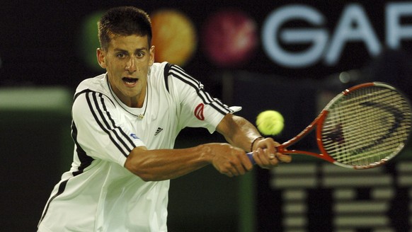 Novak Djokovic of Serbia and Montenegro in action during his match against Marat Safin of Russia (Photo by Jon Buckle - PA Images via Getty Images)