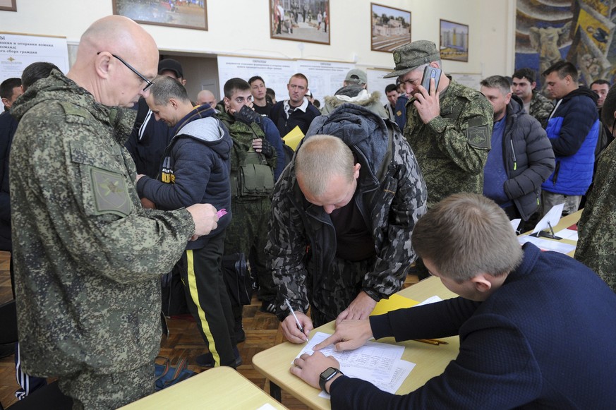 Russian recruits gather inside a military recruitment center of Bataysk, Rostov-on-Don region, south of Russia, Monday, Sept. 26, 2022. Russian President Vladimir Putin last Wednesday ordered a partia ...