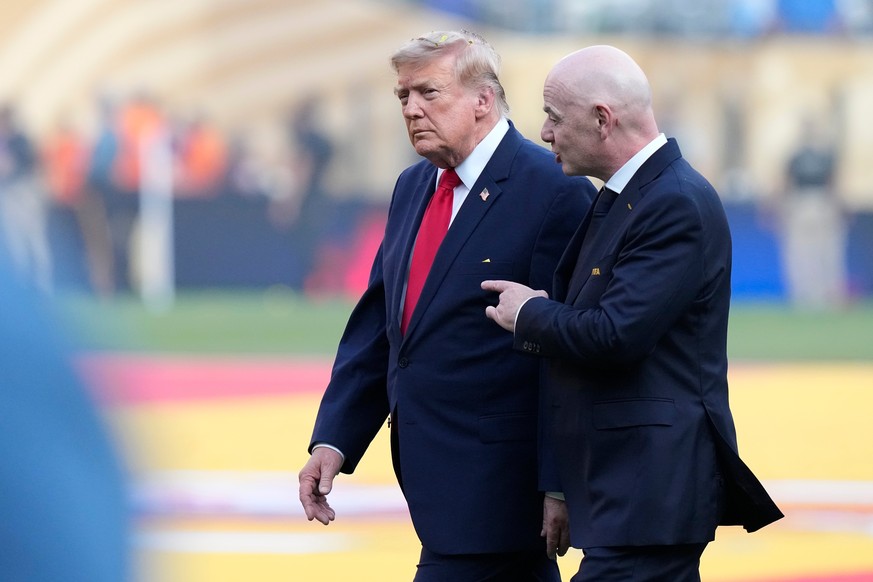 U.S. President Donald J. Trump and FIFA President Gianni Infantino leave after the presentation ceremony following the World Cup final soccer match between Spain and Argentina in East Rutherford, N.J. ...