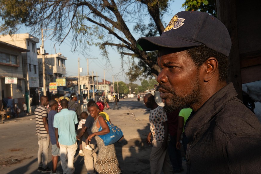 epa11196962 People gather around a penitentiary in Port-au-Prince, Haiti, 03 March 2024. At least a dozen people died after an attack last night on the Port-au-Prince civil prison by armed gangs, who  ...