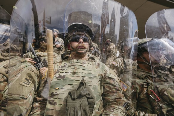 No King Rally in Los Angeles California National Guard members stand in formation during the protest in Los Angeles, California on June 14, 2025. Masses of demonstrators filled streets, parks, and pla ...