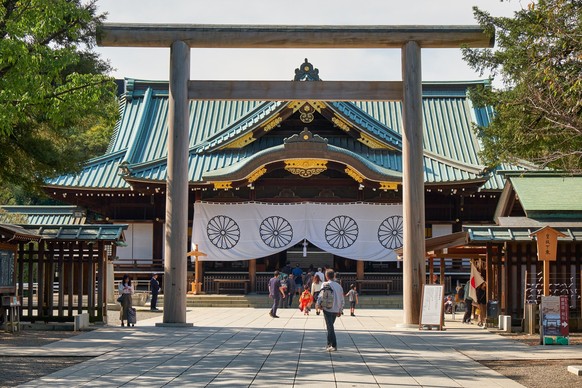 The view of Haiden Main hall through the Chumon torii at Yasukuni Shrine. Tokyo. Japan, Tokyo, Japan - October 26, 2019: The view of Main hall Haiden through the Chumon torii at Yasukuni Shinto Shrine ...