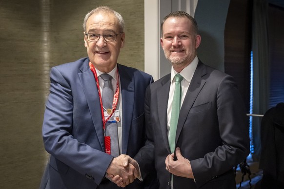 Switzerland's Federal President Guy Parmelin, left, shakes hands with US Trade Representative Jamieson Greer, right, during a bilateral meeting at the 56th annual meeting of the World Economic Fo ...