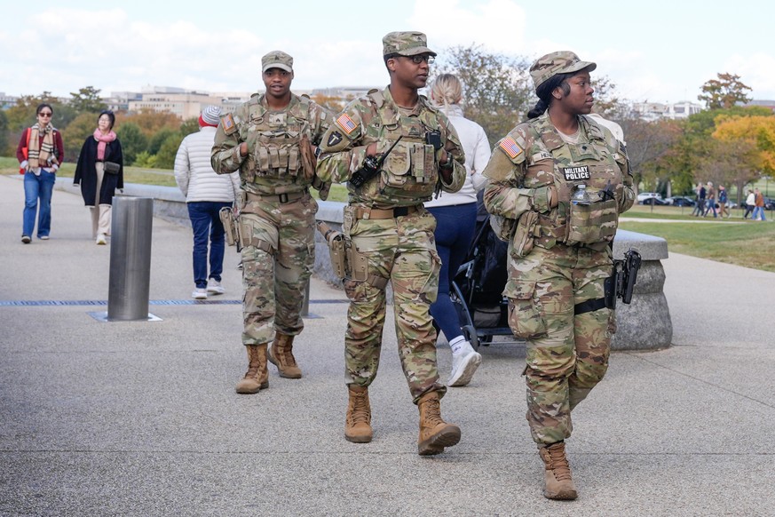 Members of the National Guard patrol along the National Mall, Friday, Oct. 24, 2025, in Washington. (AP Photo/Mariam Zuhaib)
Washington Daily Life