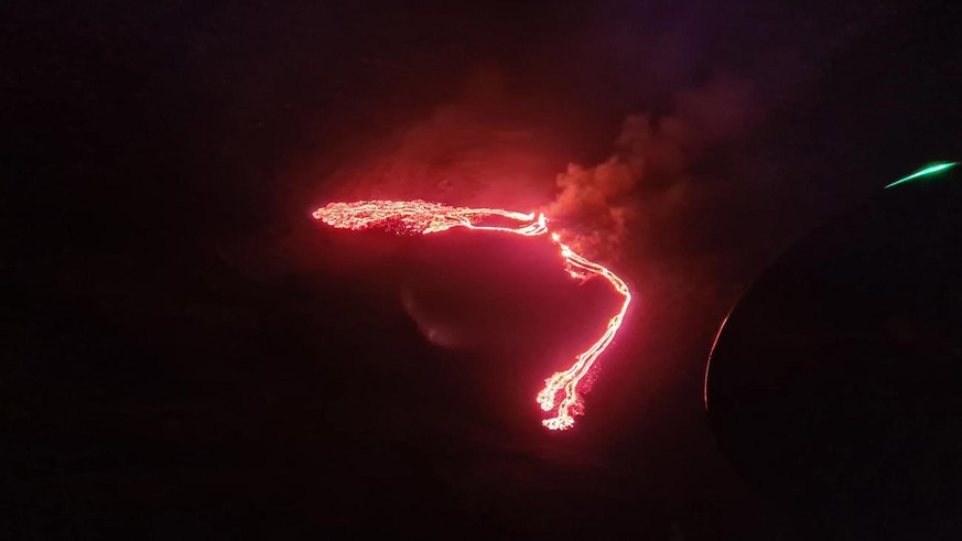 epa09084766 A handout photo made available by the Icelandic Meteorological Office shows an image taken from a Coast Guard helicopter of the volcanic eruption at Geldingadalur, close to Fagradalsfjall  ...