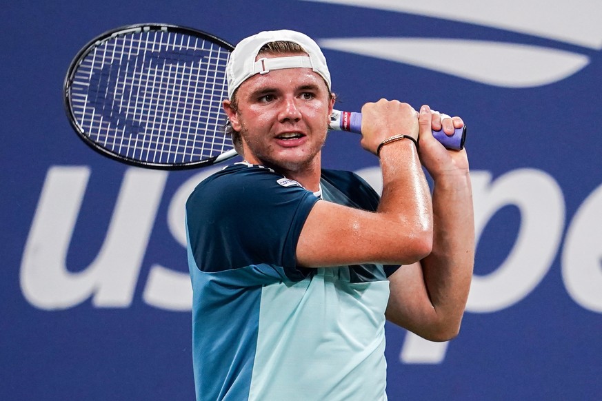 epa10838993 Dominic Stricker of Switzerland returns to Taylor Fritz of the USA during their fourth round match at the US Open Tennis Championships at the USTA National Tennis Center in Flushing Meadow ...
