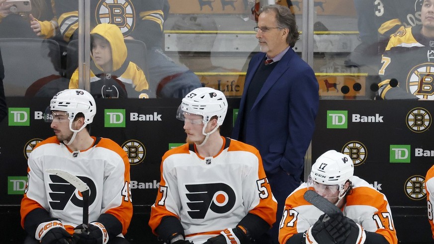 Philadelphia Flyers head coach John Tortorella , top center, looks on from bench during the third period of an NHL hockey game against the Boston Bruins, Monday, Jan. 16, 2023, in Boston. (AP Photo/Ma ...