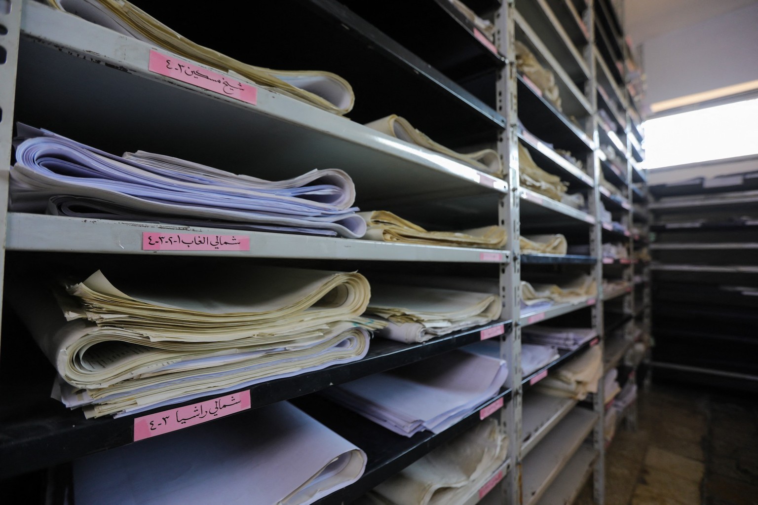 Documents are seen in an room at one of the bases of the Fourth Divison on the outskirts of Damascus on December 21, 2024. Many bases of Syriaís notorious Fourth Division, a military unit led by Maher ...