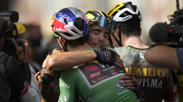 France&#039;s Christophe Laporte celebrates with Belgium&#039;s Wout Van Aert, wearing the best sprinter&#039;s green jersey after winning the nineteenth stage of the Tour de France cycling race over  ...