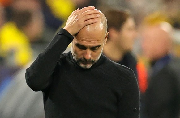 epa10265877 Manchester City manager Pep Guardiola gestures on the touchline during the UEFA Champions League group G match between Borussia Dortmund and Manchester City in Dortmund, Germany, 25 Octobe ...