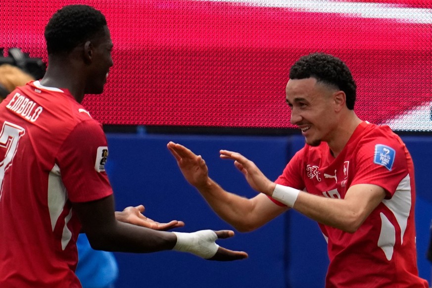 Switzerland's Ruben Vargas, right, celebrates after scoring his side's second goal during the World Cup Group B soccer match between Switzerland and Bosnia in Inglewood, Calif, near Los Ange ...