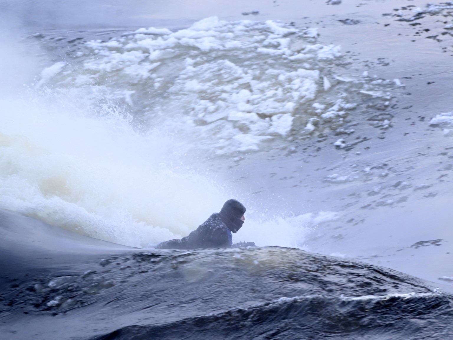 Carlos Hebert Plante boogie boards on the St. Lawrence River in Montreal, Friday, Feb. 3, 2023. Plante boogie boards all year, even on days like Friday where the temperature dipped to -26 C. (Bernard ...