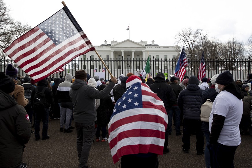 epa09756458 Hundreds of people gather to advocate for the undocumented and call on US President Joe Biden to reform United States immigration policy, on Pennsylvania Avenue outside the White House in  ...