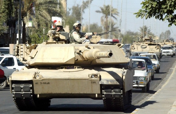 A U.S. Army M1 Abrams tank in the center of Tikrit, north of Baghdad, Monday, Nov. 17, 2003. Hundreds of American troops, tanks and assault vehicles paraded across the crowded downtown area of Saddam  ...