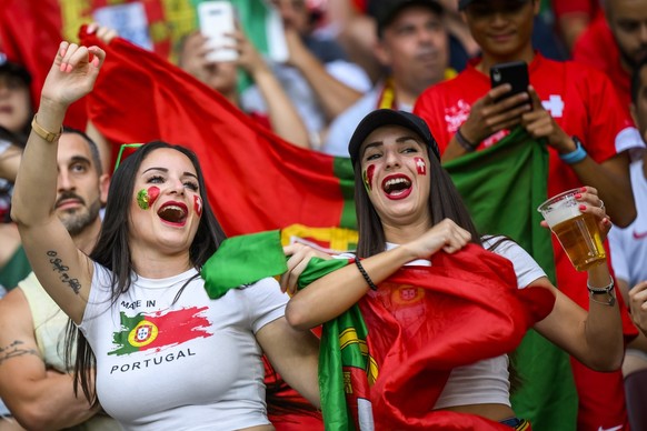 The Portugal team's fans celebrate before the UEFA Nations League group A2 soccer match between Switzerland and Portugal at the Stade de Geneve stadium, in Geneva, Switzerland, Sunday, June 12, 2022.  ...