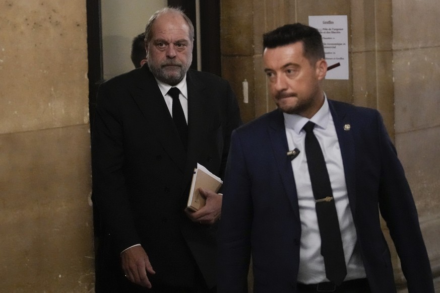 French Justice Minister Eric Dupond-Moretti , left, arrives at Paris court house, in Paris, Wednesday, Nov. 15, 2023. France&#039;s justice minister goes on trial on charges of using his office to set ...